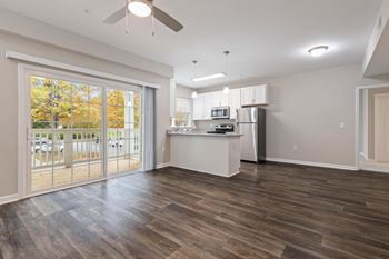 Empty living room with kitchen
